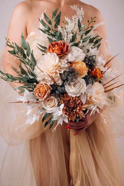 This cute burnt orange and ivory rose wedding bouquet is a stunning silk flower arrangement perfect for an autumn ceremony. This artificial boho bouquet captures the essence of fall with its warm hues and elegant design. Ideal for a fall wedding bouquet set, it offers a timeless and low-maintenance alternative to fresh flowers, ensuring lasting beauty throughout your special day. ○ Color: burnt orange, ivory, green, white ○ Personalization: I can make changes to your wishes. Colors can be change Bouquet Fall Wedding, Fall Wedding Bouquet, Silk Flower Bouquet, Fall Wedding Color Palette, Fall Bouquet, Enchanting Wedding, Rustic Bouquet, Silk Flower Bouquets, Rose Wedding Bouquet