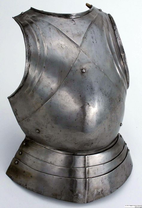 Breastplate "in the German style" Northern Italy (Milan), about 1480, steel; modern leather, the domed rivet in the center slides in a slot on the chest plate, allowing the wearer to flex his torso forward. The lipped edges at the neck and arms help deflect the points of weapons.   Weight: 6 lb. 4 oz.  Length: 14" W x 21" L x 7" D. Metal Chest Plate, Fantasy Breastplate Armor, Metal Breastplate Female, Knight Chest Plate, Medieval Breastplate, Knights Armour, Armor Breastplate, Milanese Armor, Metal Chest