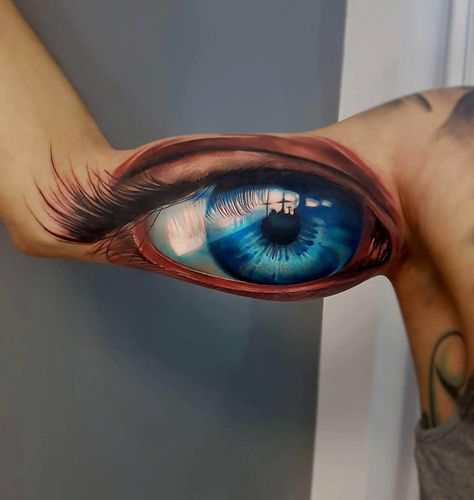 bicep tattoo blue eye Blue Eye Tattoo, Awful Tattoos, Tato 3d, Realistic Eye Tattoo, Tatuagem Masculina Pequena, Eyes Tattoo, Army Tattoos, Bicep Tattoo, Blue Tattoo