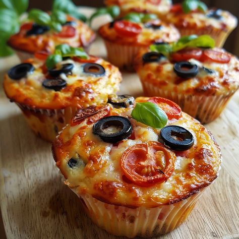 Savory Pizza Muffins Recipe Ingredients: For the Muffin Batter: 1 ½ cups all-purpose flour 1 ½ teaspoons baking powder ½ teaspoon baking soda ½ teaspoon salt 1 teaspoon dried oregano 1 teaspoon dried basil ½ teaspoon garlic powder ¼ teaspoon crushed red pepper flakes (optional) 1 large egg 1 cup buttermilk (or regular milk with 1 tablespoon of vinegar) ¼ cup vegetable oil ½ cup grated Parmesan cheese For the Toppings: 1 cup shredded mozzarella cheese ½ cup mini pepperoni slices or chopped ... Pepperoni Cups, Pepperoni Muffin Cups, Pizza Muffin, Mozzarella And Pepperoni Recipes, Mini Deep Dish Pizza Muffin Tins, Mini Pizza On English Muffin, Party Food Catering, Pepperoni Recipes, Pizza Cups