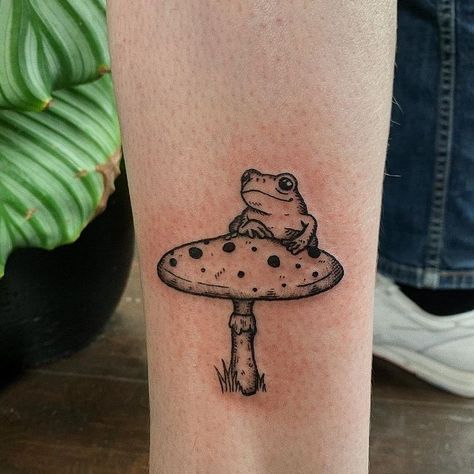 50+Frog Tattoos with Meanings 1 Frog Mushroom Tattoo, Kitten Tattoo, Ufo Tattoo, Mushroom Tattoo, Frog Mushroom, Frog Tattoo, Flower Tattoo Meanings, Framed Tattoo, Bottle Tattoo