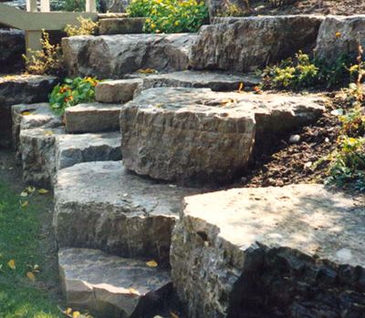 Armor stone retaining wall Retaining Wall Bricks, Lake Landscaping, Stone Landscaping, Stone Retaining Wall, Landscaping With Boulders, Landscaping Retaining Walls, Diy Pergola, Landscaping With Rocks, Outdoor Landscaping