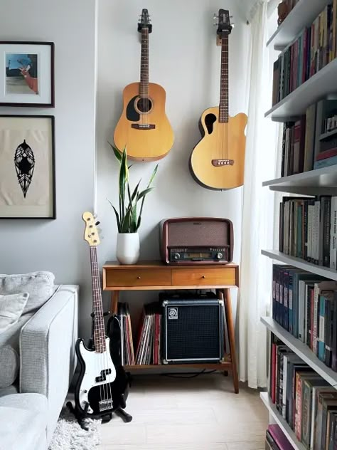 Vote on A Bright, Colorful, Modern Small/Cool Space in the Small/Cool Contest | Apartment Therapy Apartment Music Corner, Instruments In Living Room, Music Nook Spaces, Instrument Corner Living Room, Small Guitar Room, Music Listening Nook, Small Music Corner Ideas, Living Room With Instruments, Music Corner Apartment