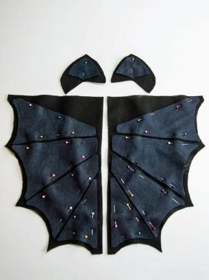 Remove the templates from all of the fabric cutouts and pin the segment pieces on the full wing cutouts. Kids Bat Costume, Diy Bat Costume, Bat Hoodie, Bat Wings Costume, Hoodie Halloween Costumes, Bat Halloween Costume, Halloween Costume Black, Bats For Kids, Handmade Halloween Costumes