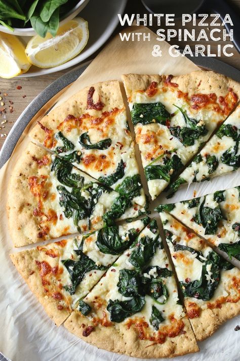 Gluten-free White Pizza with Spinach and Garlic made with Chebe Bread Pizza Crust Mix. It's easy to make but sure looks fancy! #pizza #whitepizza #pizzarecipe #chebe #spinach #garlic #easy #homemadepizza #fancypizza White Pizza Sauce Recipe, Pizza With Spinach, Cast Iron Pizza Pan, Fancy Pizza, White Pizza Sauce, White Pizza Recipes, Garlic Pizza, Spinach Pizza, Pizza Bianca