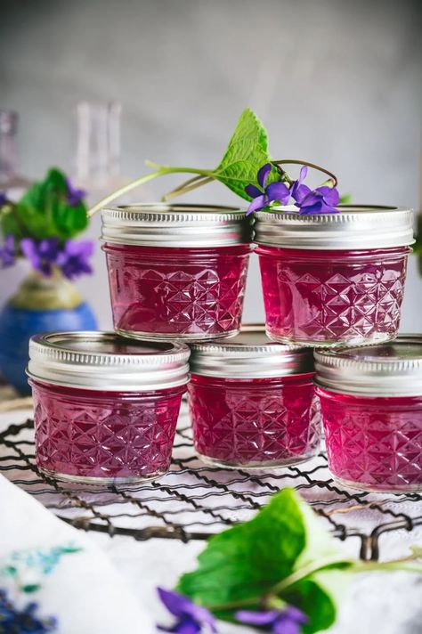 Learn how to make beautiful purple violet jelly from the flower petals of wild violets. | fareisle.com #violetjelly #violet #violets #wildviolets #violetrecipes #canning #homemadejelly #jelly #foraging #edibleflowers #recipes #spring #foodphotography #foodstyling Violet Jelly, Wild Violets, Homemade Jelly, Jelly Recipe, Fine Mesh Strainer, Jelly Jars, Jelly Recipes, Purple Violet, Edible Flowers