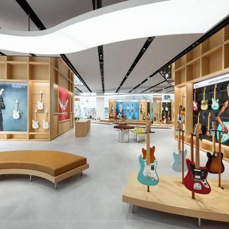 Music Shop Design, Music Store Interior, Glass Display Unit, Yas Island Abu Dhabi, Dubai Interior Design, Led Display Board, Yas Island, Guitar Display, Wooden Facade