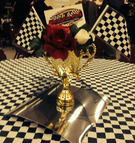 Racing Theme Centerpiece.                                 (Made by original pinner) #racing #nascar Checkered Flag Centerpieces, Nascar Party Decorations, Nascar Wedding, Racing Crafts, F1 Party, Car Themed Wedding, Track Logo, Nascar Party, Sports Themed Wedding