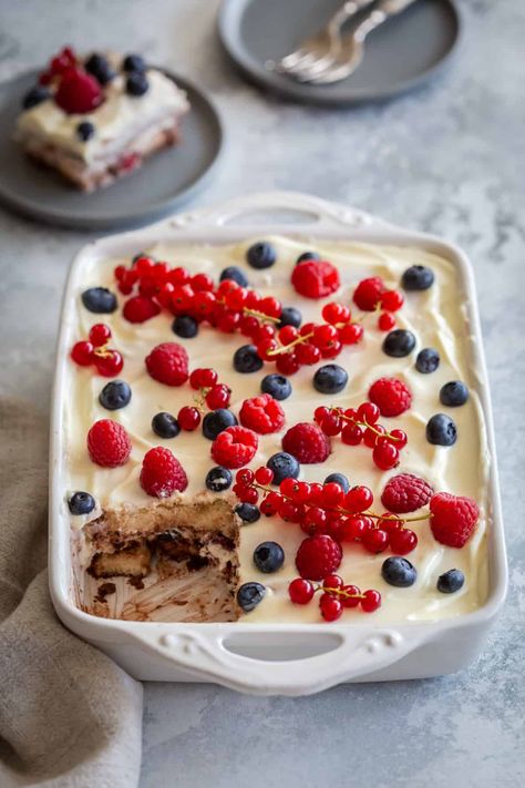 This delicious Berry Tiramisu is a delightful variation of the classic Italian dessert that combines the rich flavors of mascarpone cheese, ladyfingers, mixed berries and a hint of cocoa.  An easy to make treat, kid friendly, ideal for summer parties and for any other occasion. It is a twist of the Classic Tiramisu, perfect for those who want to avoid raw eggs, alcohol and coffee. Read on how to prepare this no-bake tiramisu cake in your kitchen with simple ingredients and no fuss! The pos... Fresh Berries Dessert, Berry Tiramisu, Classic Tiramisu, Raw Eggs, Colorful Desserts, Italian Dessert, Berry Dessert, Ceramic Baking Dish, Baking Basics