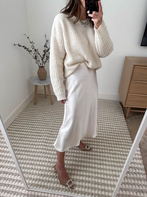 Vince Slip Skirt curated on LTK Slip Dress Outfit With Sweater, Slip Skirt Holiday Outfit, Slip Skirt Wedding Guest Outfit, Champagne Midi Skirt Outfit, Champagne Slip Skirt Outfit, Slip Skirt And Sweater Outfit, Cream Slip Skirt Outfit, White Knit Skirt Outfit, White Slip Skirt Outfit