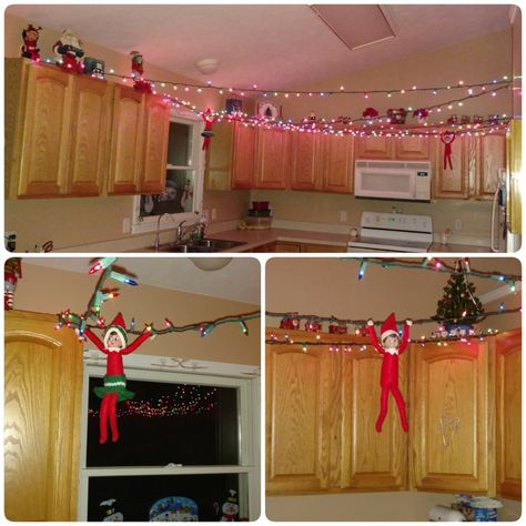 Elf Christmas Lights, Elf On The Shelf Kitchen Ideas, Elf On The Shelf Laundry Room, Elf On The Shelf Christmas Lights, Elf On The Shelf Ideas Kitchen Cabinets, Elf On The Shelf Ideas Chandelier, Elf Om Shelf Ideas, Elf On The Shelf Messy Room, Elf On The Shelf Chandelier