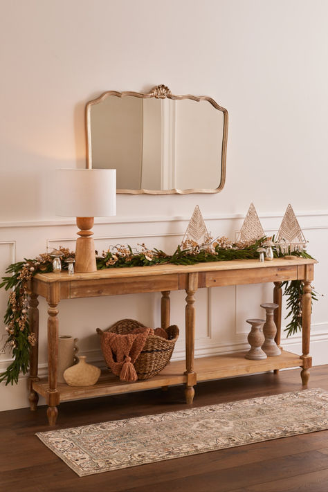 Crafted of natural wood with a weathered finish, our exclusive Everett Weathered Natural Wood Foyer Table impresses with its Victorian-inspired architectural good looks. Featuring two hidden drawers and an open shelf, this long foyer table provides ample storage space in any room, entrance area, or hallway. With vintage-style sculptural legs and a subtly weathered rustic finish, this farmhouse table is versatile enough to complement a range of decor and furniture. #WorldMarket Cottagecore Console Table, Long Foyer Table, Wood Foyer Table, Long Foyer, Natural Wood Console Table, Unique Living Room Furniture, Christmas Entryway, Entryway Table Decor, Foyer Table