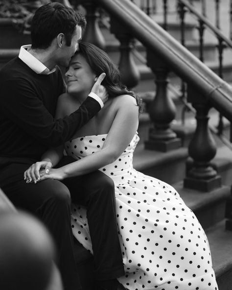 Romantic black and white portrait of couple embracing on NYC brownstone steps, woman in polka dot dress Engagement Photos Urban Setting, Fancy Engagement Photos, Black And White Engagement Photos, Engagement Photos Romantic, Nyc Engagement Photos, Formal Engagement Photos, Nyc Love, Traditional Engagement, Dress Engagement