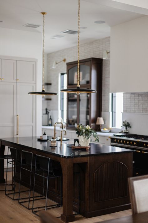 Mixed tones in this kitchen. The cabinetry is pretty stunning... 😍 · · · · · · · · · www.laurenjanoskigroup.com · #RealEstateAgents #Minnesota #MNRealtors #MNRealEstate #TwinCitiesRealEstate #MinneapolisAgent #AllThingsRealEstate #RealEstateAgent #RealEstate #LuxuryRealEstate #LuxuryListings #BestOfTwinCities #Trending #MidwestLiving #MidwestIsBest #Minnstagramers #MidwestHomes #TheLJGDifference #LJG #TheLaurenJanoskiGroup #ColdwellBanker #ColdwellBankerGlobalLuxury #Minneapolis #HomeDesign Fresh Concrete Caesarstone, Stained Island, Kitchen Sconces, Walnut Kitchen Island, Meridian House, Recessed Cabinet, Sophisticated Interior, Walnut Kitchen, Home Bunch