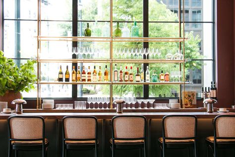 For the absolutely stunning Lucian Books and Wine in Atlanta, Georgia, Amuneal made a 2 Bay Collector's Counter to Ceiling Back Bar. The window-front shelving unit features warm brass posts with six integral LED light bars, along with 1/2" thick low-iron tempered glass shelves - a grand bar to match an equally grand space! #openshelving #barshelving #barshelvingideas #brassshelves #interiordesignideas #homedecorideas Restaurant Shelves, Restaurant Shelving, Bar Shelving, Atrium Design, Futuristic Building, Bar Shelves, Tempered Glass Shelves, Pixel Design, Back Bar