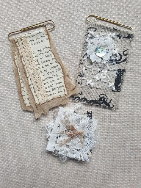 A set of three paper clip embellishments to add interest to a journal page and for attaching ephemera such as tickets, notes etc. The large paper clips are 5cm in length and the designs measure 7.5cm x 4.5cm. The cluster is made up of four 4cm squares of layered lace, ribbon, material and handmade paper, overall size 5cm x 5cm. The paper clip on the back is 3cm. All sizes are approximate. Embellished Paper Clips, Paper Ephemera Ideas, Junk Journal Paper Clips, Snippets For Junk Journals, Altered Paper Clips Ideas, Junk Journal Embellishments Ephemera, Hidden Paper Clips, Altered Paper Clips, Handmade Ephemera