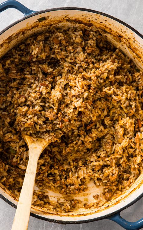 Cajun Rice Dressing: Make room for this Louisiana specialty, Cajun Rice Dressing, on your Thanksgiving dinner table. Packed with meaty flavor and the holy trinity of onions, celery, and green pepper, it will be a hit at gatherings big and small. Cajun Rice Dressing, Cajun Rice, Rice Dressing, Cooks Country, Cooks Country Recipes, Cooking Onions, Creole Cooking, Thanksgiving Dinner Table, Chicken Liver