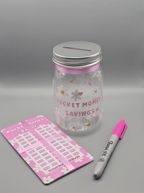 Children’s pocket money savings jar. 6 Trackers  and pen bundle. by CustomisebymeShop on Etsy Cute Money Saving Jars, Diy Savings Box Ideas, Diy Money Jar, Saving Money Jars, Saving Jar, Daisy Theme, Money Saving Jar, Pink Pen, Money Tracker