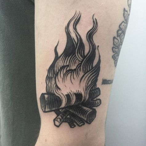 A traditional black tattoo of a campfire inked on the left arm #UltraCoolTattoos Tattoo Traditional Flash, Traditional Black Tattoo, Tattoo Old School, Flame Tattoos, Traditional Flash, Fire Tattoo, Tattoo Traditional, Black Tattoo, Feather Tattoos