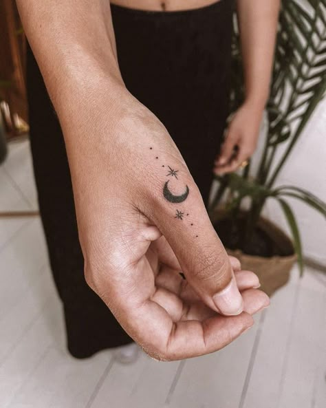 26 Sparkle Tattoo Designs To Find Your Stellar Inspiration 19 Phases Of The Moon Finger Tattoo, Crescent Moon Tattoo On Finger, Moon Phase Tattoo With Stars, Moon Phases Hand Tattoo, Moon Phase Finger Tattoo, M&m Tattoo, Finger Moon Tattoo, Finger Tattoo Moon, Small Moon Tattoo Designs