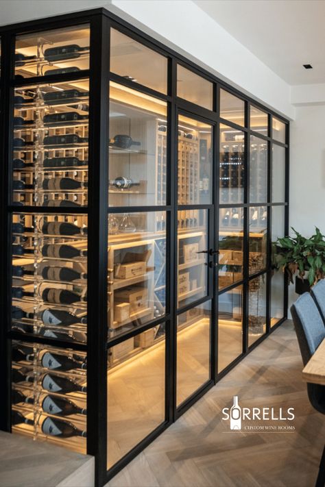 A Sorrells wine room with a black frame and door to finish Wine Cellar Wall, Wine Room Design, Glass Wine Cellar, Wine Closet, Legend Homes, Wine Cave, Bar Sala, Home Wine Cellars, Custom Wine Cellars