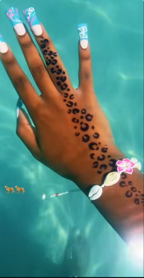 #handtattoo #handtattoosforwomen #bodyarttattoo #cheetah #jaguar #leopard #nails #nailart #accessories #bracelet #seashells #bluenails #tattoo #aesthetic Leopard Wrist Tattoo, Leopard Print Hand Tattoo, Cheetah Tattoo On Thigh, Cheetah Print Tattoo, Cheetah Print Tattoo On Shoulder, Leopard Stretching Tattoo, Leopard Print Tattoo, Shoulder Cheetah Print Tattoo, Cheetah Print Tattoos