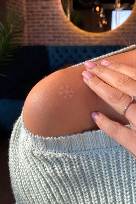 White Tattoo Snowflake, Snowflake Tattoo White, White Ink Snowflake Tattoo, Tattoo Ideas Snowflake, Frozen Inspired Tattoo, Snowflakes Tattoo Design, Simple White Tattoos, Sun And Snowflake Tattoo, Tiny Snowflake Tattoo