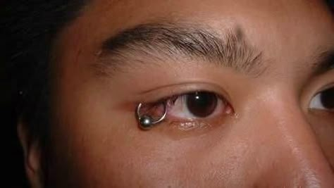 Eyelid Piercing, So “Cool” | Oddity Central - Collecting Oddities Piercing Under Eye, Eyelid Piercing, Master Tattoo, Vertical Labret, Surface Piercing, Eye Piercing, Best Easy Hairstyles, Piercing Eyes, Face Piercings