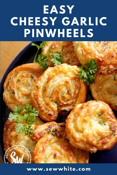 This cheesy garlic pinwheels recipe packs a serious punch of garlic flavour that will satisfy even the most die-hard garlic fan. The garlic and herb butter is smeared over the puff pastry and topped with grated cheese before rolling. This is a recipe for all garlic lovers! Grilled Cheese Pinwheels, Garlic Pinwheels, Bread Pinwheels, Cheese Pastry Puff, Cheese Pinwheels Puff Pastries, Pinwheel Appetizers Puff Pastry, Puff Pastry Side Dish, Crescent Pinwheels, Savoury Baking Recipes