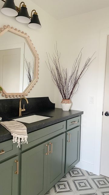 Half Bath Black Countertop, Green Vanity With Black Countertop, Bathroom With Grey Countertop, Green Cabinets Black Countertop Bathroom, Green Bathroom Vanity Black Counter, Green Vanity Black Countertop, Bathroom Inspo Black Countertop, Painted Bathroom Vanity With Black Granite Top, Black Countertops Bathroom Color Schemes