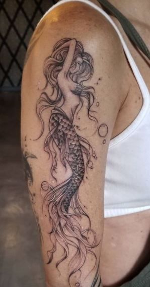 Back Of Arm Mermaid Tattoo Women, Mermaid With Waves Tattoo, Girly Mermaid Tattoos, Wrap Around Mermaid Tattoo, Rosevine Tattoo, Murmades Tattoo, Meaning Of Mermaid Tattoo, Amphrite Goddess Tattoo, Womens Mermaid Tattoo