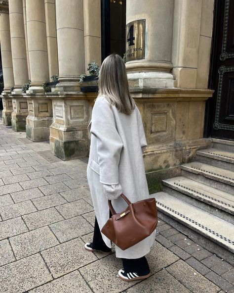 Her first outing 🥹💼🤎 outfit details below & linked on my @shop.ltk . Bag - @demellierlondon *pr Jumper & trousers - @arketofficial *pr Coat - old @hm Trainers - @adidas samba Belt - @amazonfashioneu Sunglasses - @ysl . . Transitional outfits, adidas sambas, black trousers, Demellier New York midi bag, minimal outfits . . #demellier #demellierlondon #adidassamba #adidassambaclassic #sambas #arket #arketofficial #blacktrousers #tanbag #brownbag #leatherbag #streetstyleluxe #streetstyleins... Demellier New York Bag Outfit, Demellier Bags Outfit, Hand Bag Outfit, Demellier New York, Demellier Bag, Demellier Bags, Demellier London, Sambas Black, Transitional Outfits