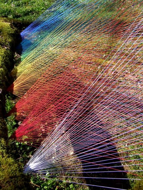 Sébastien Preschoux creates intricate installations in natural environments using hundreds of feet of multi-colored string. A quote from Preschoux from trendland:  Nowadays, the new generation disposes of images as a industrial rapidity and they are not asking themselves about where these things are coming from. Is it handmade or is it an electronic work? When they are faced with creating handmade work, they realize the labor and time it takes. The result is way more important than a printed ... String Installation, Colossal Art, Thread Art, Land Art, Environmental Art, French Artists, String Art, Public Art, Art Plastique