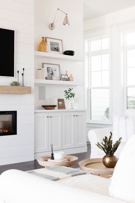 Creating a warm, inviting living room at the Alice River House was all about the details. We framed out the fireplace, installed shiplap, and added a custom-built mantle for a timeless look. The wall sconces and 60” electric fireplace make this the coziest living room  🪵 ⁠
⁠
⁠
#splendidhomedesign #houseenvy #ihavethisthingwithcolor #interiordesire #interiordesign #kitchenandbathdesign #remodel #remodels #tile #kitchen #instaremodel #designer #kitchens #homegoals #countertops Small Home Interior, Cheap Christmas Decor, Shelf Decor Ideas, Cheap Beach Decor, Southern Home Interior, Designer Kitchens, Inviting Living Room, Cheap Farmhouse Decor, Home Decor Shelves