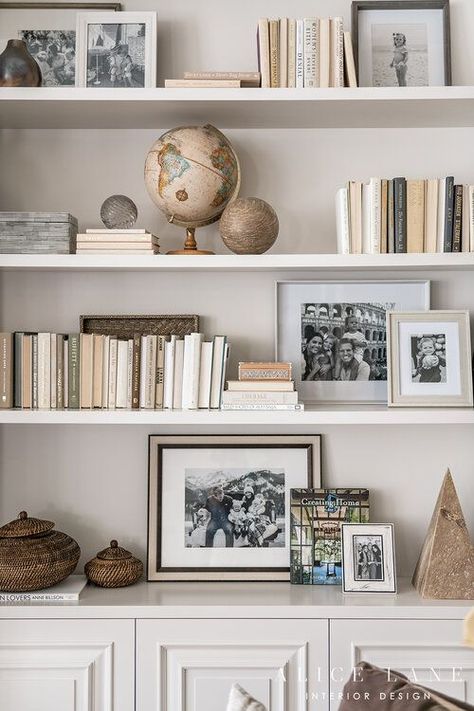 Love this shelf styling! How to style books, photographs, picture frames, and objects on shelves or bookshelves. Lovely neutral colour scheme. PARCELL HOME — ALICE LANE INTERIOR DESIGN Acrylic Shelf Styling, Tv Shelf Decorating Ideas, Shelf Styling With Books, Shelf Astethic, Bookcase Decorating, Styling Bookcases, Shelves Styling, Styled Shelves, Bookshelf Inspo