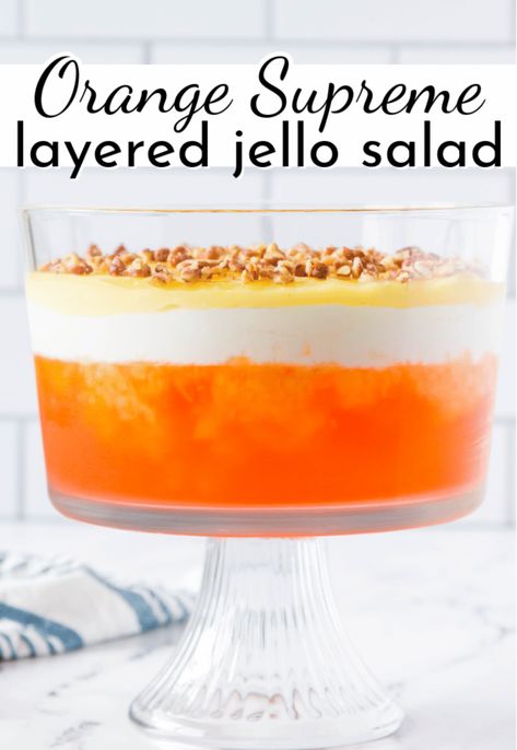 Add a pop of color to the holiday table with this beautiful orange, white and yellow layered Jello Salad. The tart orange Jello salad is paired with sweet whipped topping, cream cheese and topped with a homemade custard! Layered Jello Salad, Mandarin Orange Jello Salad, Orange Jello Salad, Jello Fruit Salads, Orange Jello Salads, Pineapple Jello, Jello Mold Recipes, Congealed Salad, Gelatin Salad