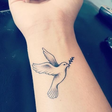 Friendship Dove Tattoo, Dove Holding Olive Branch Tattoo, Christian Dove Tattoo, World Peace Tattoo, Dove Tattoo Traditional, Dove Olive Branch Tattoo, Dove And Olive Branch Tattoo, Traditional Dove Tattoo, Dove With Olive Branch Tattoo