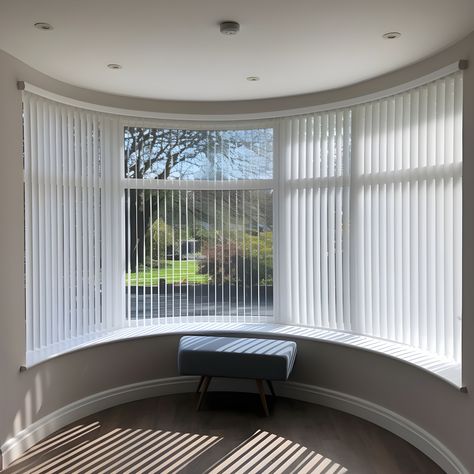 Vertical blinds in a curved bay window, adding functionality and style to the room. Blinds For Bay Windows, Curved Bay Window, Bay Window Decor, Bay Window Blinds, Fitted Blinds, Bay Windows, Vertical Blinds, Bay Window, Room Designs