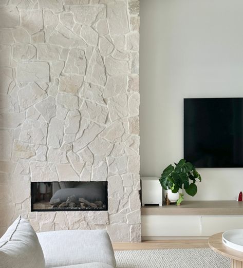 Stone Fireplace And Tv Wall Ideas, Square Fireplace Surround, Cream Stone Fireplace Living Room, Stone Wall Living Room With Tv, Limestone Veneer Fireplace, Cream Stone Fireplace, Stone Wall Tv, White Rock Fireplace, Modern Hamptons Style Living Rooms