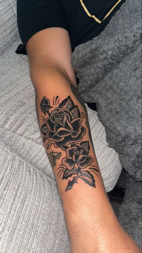 Roman Numeral Rose Tattoo, Manly Flower Tattoos, Forearm Tattoo Men Rose, Men’s Forearm Tattoos Flower, Small Black Rose Tattoo Men, Rose Patchwork Tattoo, Masculine Rose Tattoo Men, Men’s Rose Forearm Tattoos, Rose Tattoo Men Arm