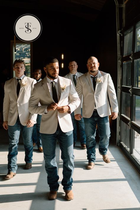 Groom and Groomsmen are #weddingdayready in white dress shirts, ties and tan jackets from @menswearhouse and lightwash jeans and brown boots from @ariatintl #groomsmenstyle #jeansbootsjackets #jeansandbootswedding #cowboywedding #sainteterrewedding Tan Suit Groom And Groomsmen, Tan Wedding Groomsmen, Wedding Men In Jeans, No Tux Wedding Groom Attire, Jeans With Suit Jacket Men Wedding, Tan Jacket With Jeans Wedding, Jean Groom Attire, Jeans And Boots Wedding, Western Wedding Mens Attire Groom And Groomsmen