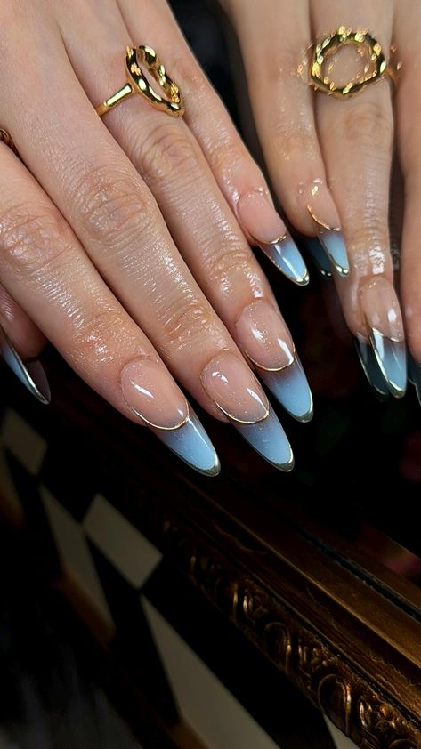 Elevate your look with these stunning, hand-crafted "Golden Horizon" Press-On Nails. Featuring a captivating ombré transition from sky blue to deep blue, each nail is outlined with a sleek, luxurious gold trim, giving you the ultimate chic and sophisticated vibe.  *Please be aware that each set is handmade, so slight variations make every design unique. 1️⃣ For Best Results! 💅✨ We highly recommend our UV Gel Glue Set to keep your press-on nails secure for up to 4 weeks! 📌 Find it in our store's "Featured Items"! Meanwhile, Each pair of press-on nails comes with a professional tool set FOR FREE, including:   - 1 sheet of removable nail tabs (strong enough to keep your nails in place for up to 1-2 weeks).   - 1 dual-sided nail file for prepping or reshaping.   - 1 cuticle stick for nail pr Blue French Tips Almond, French Tips Nails Almond, Gel Nails Y2k, French Tips Nails, Ombre French Tips, Almond Press On Nails, Nails Y2k, Gel Glue, Tips Nails