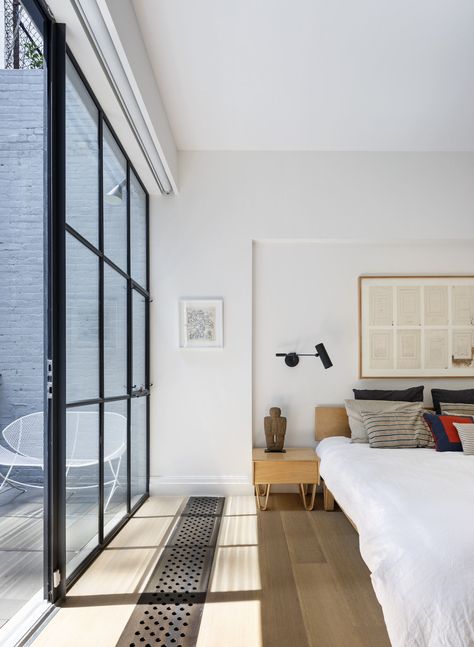 The master bedroom features floor-to-ceiling windows and access to a small deck that overlooks the backyard. Note the niftily hidden blinds. Floor To Ceiling Windows Apartment, Hidden Blinds, Concealed Blinds, Space Reference, Floor To Ceiling Window, Ceiling Window, Brighten Room, Nyc Townhouse, Townhouse Interior