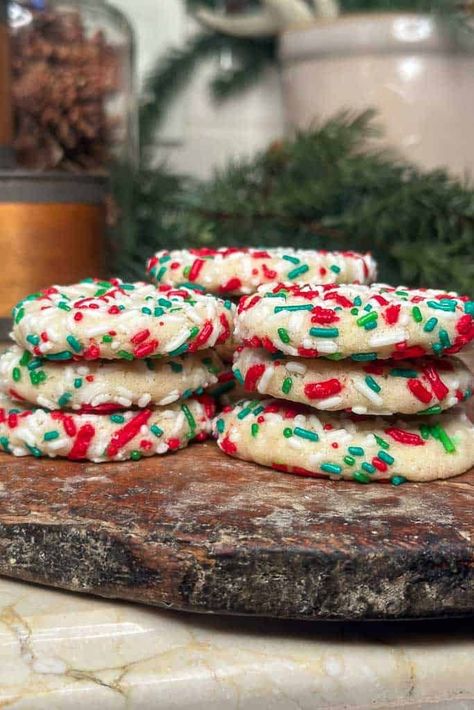 Learn how to make soft and chewy sugar cookies with sprinkles. Drop Style Christmas Sugar Cookies, Christmas Butter Sprinkle Cookies, Holiday Sprinkle Cookies, Sprinkle Christmas Cookies, Sugar Cookies Aesthetic, Christmas Cookies With Sprinkles, Christmas Sprinkle Cookies, Sprinkle Sugar Cookies, Soft And Chewy Sugar Cookies