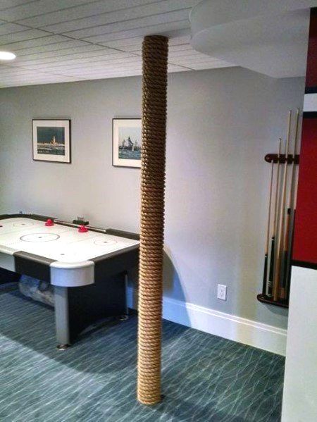 Discover how to hide unsightly support beams and steel posts with the top 50 best basement pole ideas. Explore unique downstair column cover designs. Basement Pole Ideas, Basement Pole Wrap, Basement Pole Covers, Basement Poles, Small Basement Remodel, Basement Inspiration, Diy Basement, Waterproofing Basement, Small Basements