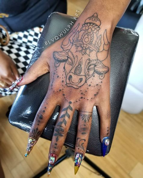 Tattoo Artist & Illustrator on Instagram: “Got a good start on this Hindu-inspired/Taurus hand piece! 🐮🖤🐺” Bull Hand Tattoo For Women, Taurus Neck Tattoo, Taurus Tattoo For Black Women, Taurus Arm Tattoos For Women, Taurus Mandala Tattoo, Bull Tattoo Feminine Taurus, Bull Hand Tattoo, Taurus Hand Tattoo, Taurus Bull Tattoos For Women