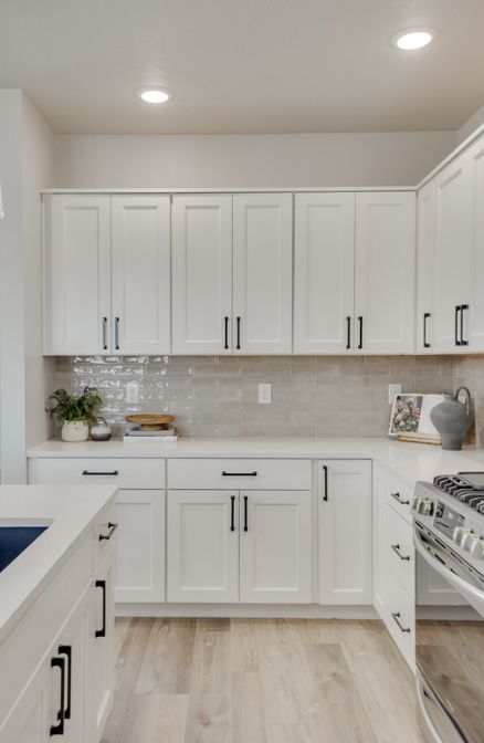 Farmhouse Kitchen Light Floors, White Counter Tops With White Cabinets, White Kitchen Small Apartment, Wood Floor With White Cabinets, White Cabinets Wood Floor Kitchen, Kitchen Remodel Oak Floors, New White Kitchen, Small White Cabinet Kitchen, Minimalist White Kitchen Design