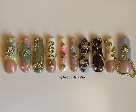 Your favorite nail tech turned 22✨🌸☀️✨ Custom birthday set for myself @zahrazshahh Here’s a rundown of the inspiration behind this set: Zahra in Arabic means flower so i based it around 3D flowers, I was born on the summer solstice so i added some gold sun charms, and my birth stone is a pearl so i added a few for embellishment. Everything is hand sculpted and painted by me ✨ #njnailtech #bestofnjbeauty #njnails #gelxnails #custompressons #custombirthdaynails #birthdaynails #nycnails #n... I <3 Me Nails, Long Junk Nails With Charms, Gold Nail Charms, 22 Nails Birthday, Nails With Numbers On Them, Nail Page Name Ideas, Arabic Nails, Cute Nails With Charms, Gold Charm Nails