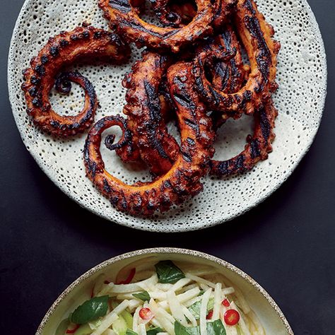 7 Best Recipes for Octopus: It may seem daunting, but octopus is worth tackling at home. Whether grilled or braised, the tender tentacles are incredibly delicious and can be served in a myriad of ways. Here, F&W's best ways to cook your new favorite cephalopod. | Food & Wine Octopus Recipes, Chile Sauce, Grilled Octopus, Seafood Dishes, Fish And Seafood, Easy Cooking, Potato Recipes, Sauce Recipes, Fish Recipes