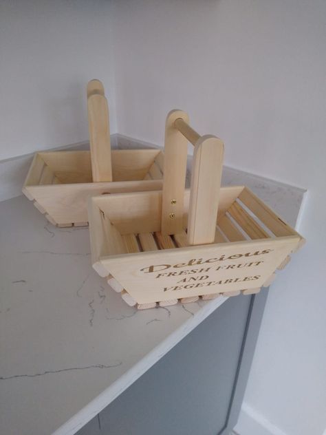 This handmade wooden basket Trug is Eco friendly made from reclaimed timber. An ideal gift for any gardener. This Trug can be used in the garden for fruit or plants also perfect for storing your fruit and vegetables and add it to your kitchen counter. It would be a great present for friend or family.  The size of this product is: L 36cm D 23cm H 11cm  The highest point of the handle is: 28cm  ** Please note the FRUIT is NOT Included ** Wooden Baskets, Wooden Fruit Basket Ideas Kitchen, Wooden Fruit Boxes Ideas, Wooden Fruit Basket, Wooden Bowl, Wood Fruit Basket, Fruit Bowl Wood, Fruit Basket Diy Gift, Wood Fruit Basket Target